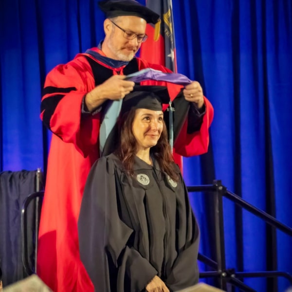 MGA Grad Student Receiving Her Hood Regalia